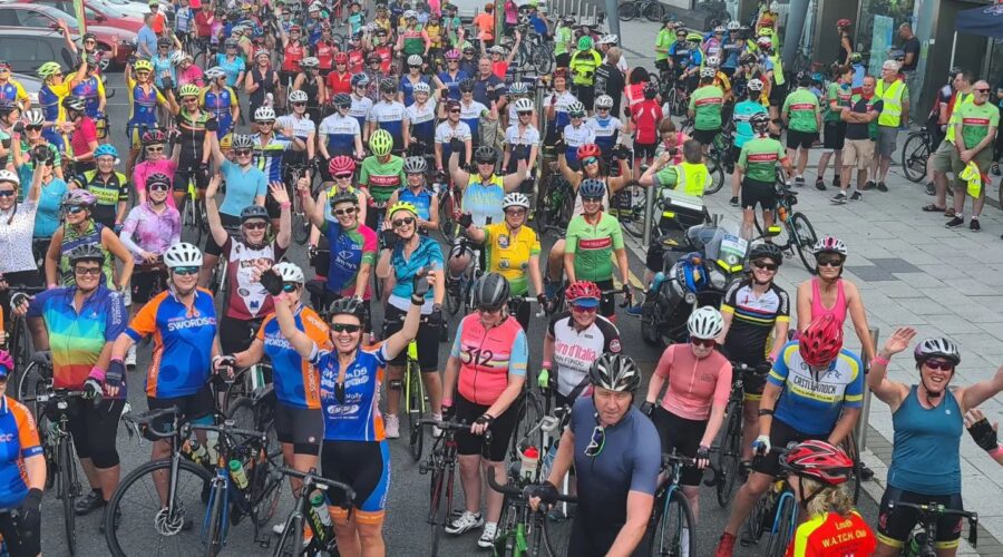 Ariel view of large group of cyclists with their bikes.