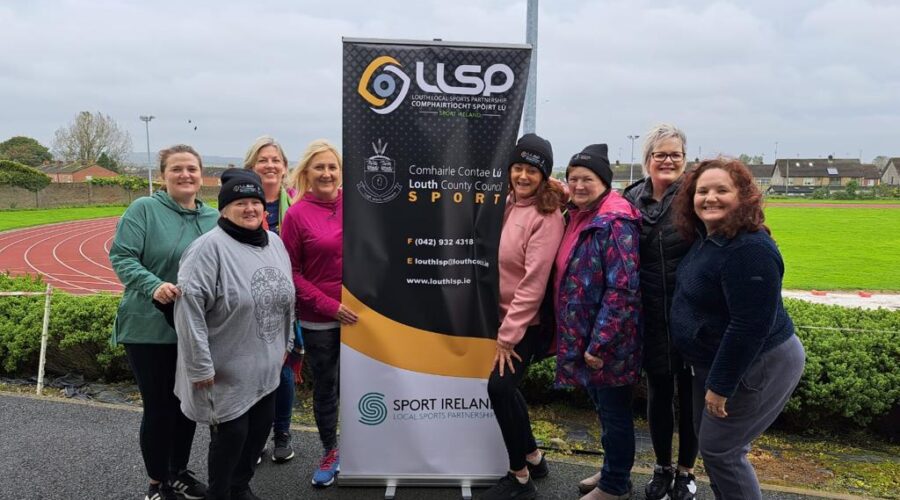 Moneymore Hub - Connect Walking Group of a group of women standing by sign for LLSP.