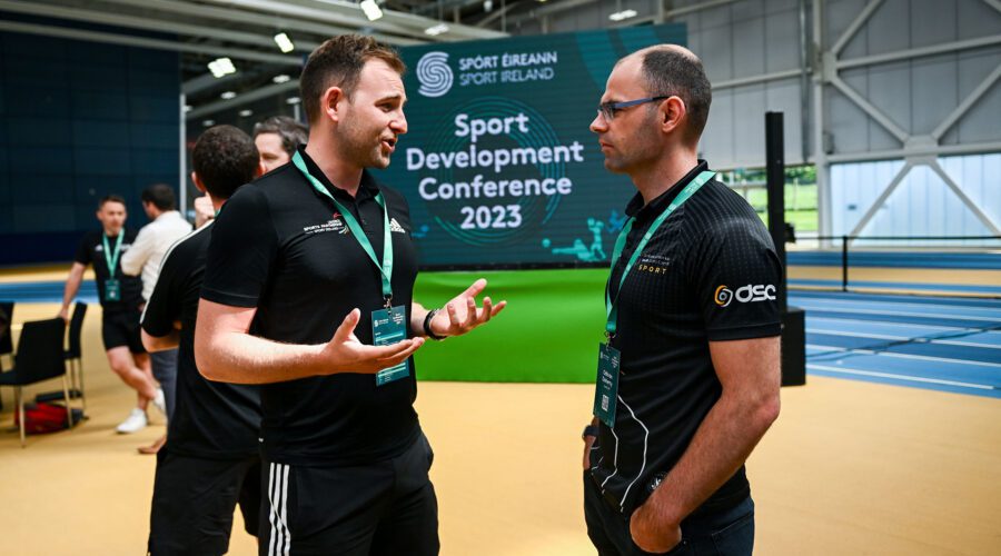 Louth LSP's Odhrán speaks with a member of Limerick Sports at the Sports Development Conference 2023.