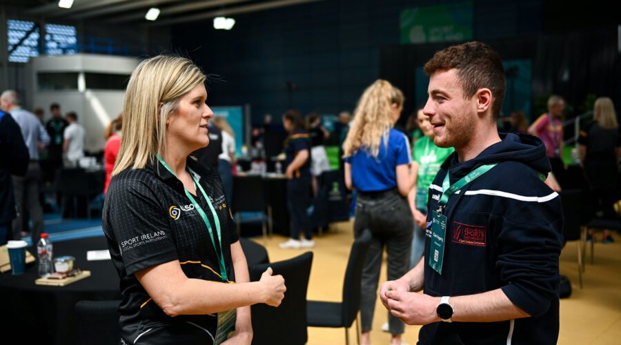 Louth LSP's Julie speaks with a member of Westmeath Sports at the Sports Development Conference 2023.