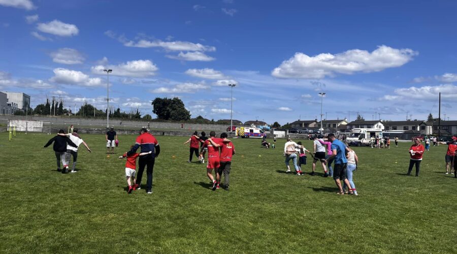 Group partake in a one legged race.